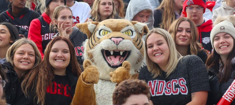 North Dakota State University students on campus with mascot